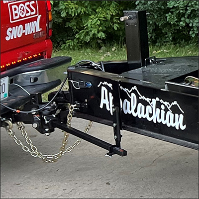 Up close to hitch on back of red truck | Sanderson Auto Repair